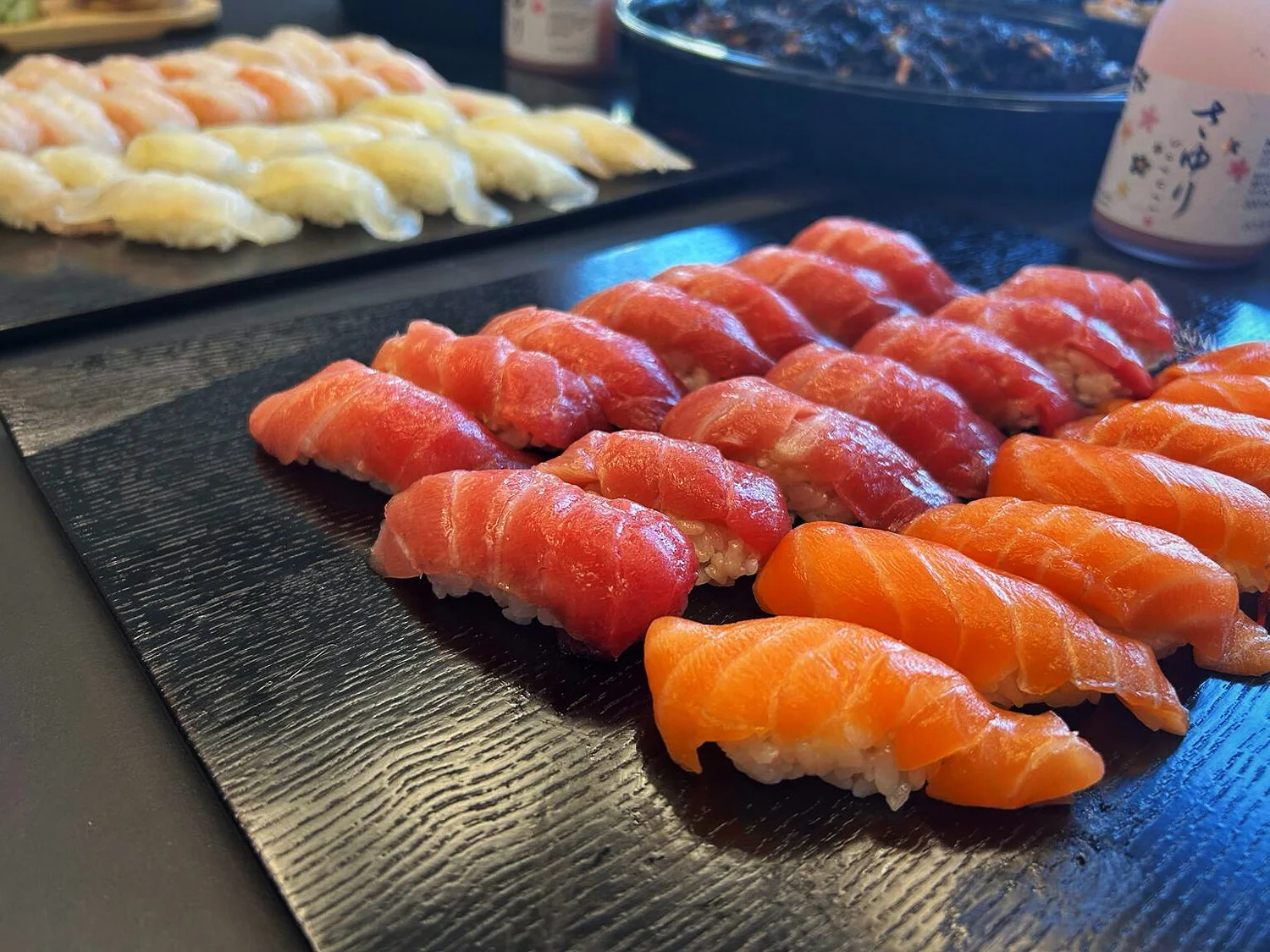 Freshly prepared nigiri on ceramic serving plates